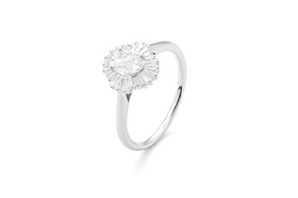 0.71 ct. Engagement Ring with Oval Cut Diamond Surrounded by Baguette Diamonds